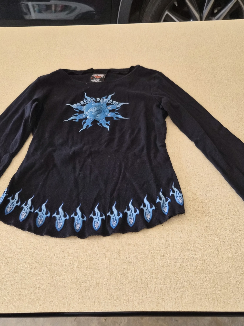Harley-Davidson Black Tee featuring blue flame graphics.